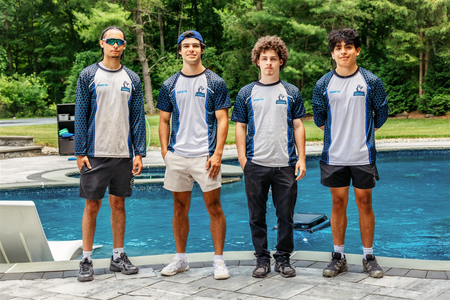 The Pure Blue crew in company uniforms