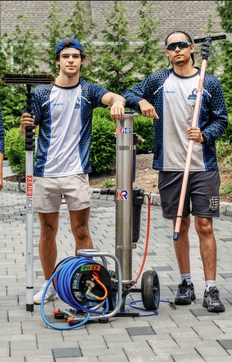 Pure Blue owners Jeremy and Dan with professional window-cleaning equipment