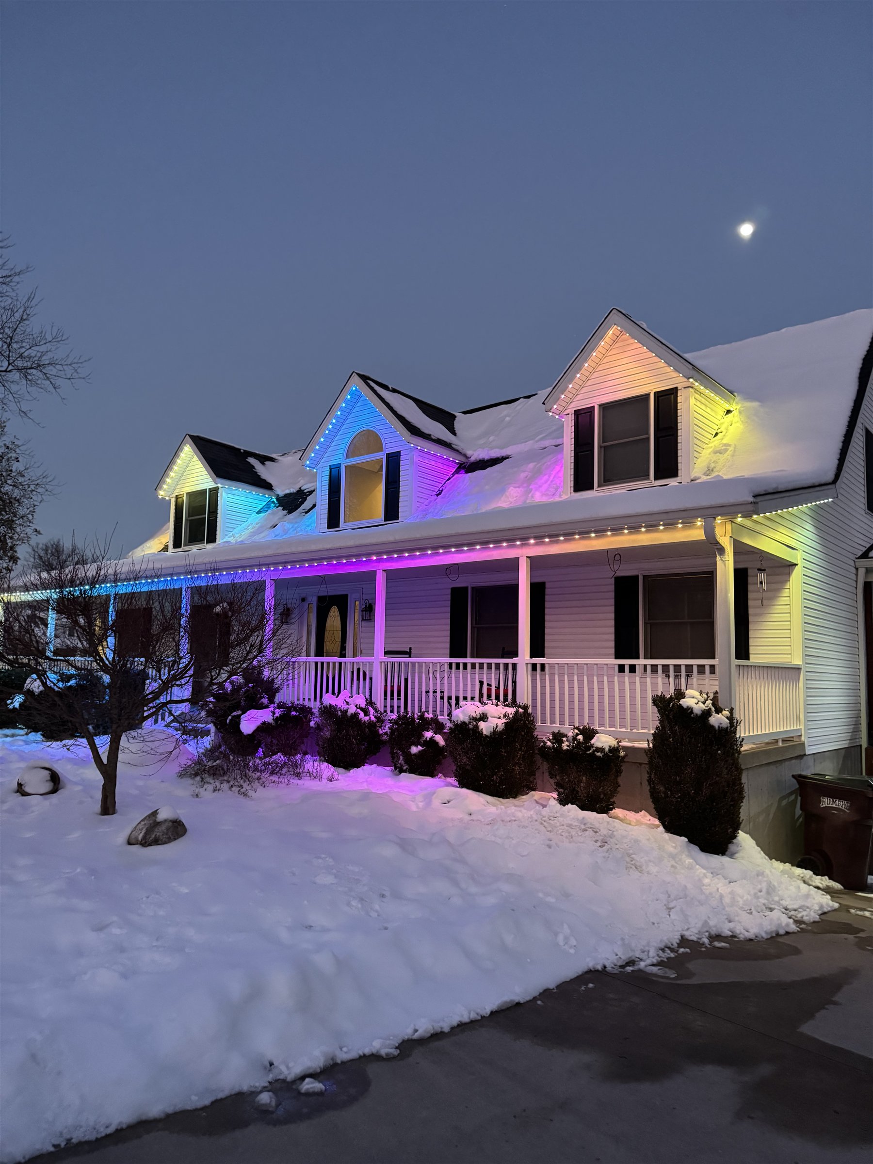 Permanent exterior lights displaying a custom multicolor pattern